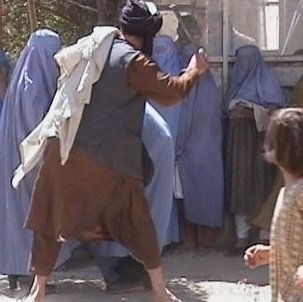 Taliban_beating_woman_in_public_RAWA